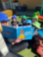Educator reading the Speedy Sloth | TG's Child Care | Brilliant-Online