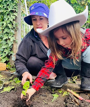 TG's Armidale child planting a seedling