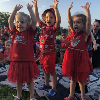 Three children singing at TG's Hastings Street End of Year Celebrations | TG's Child Care