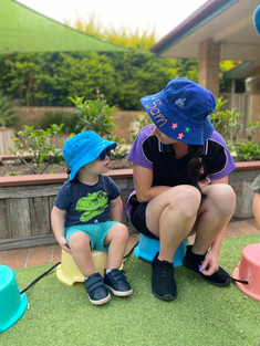 tg's riverbreeze educator having a little friendly chat with a toddler  | TG's Child Care | Brilliant-Online