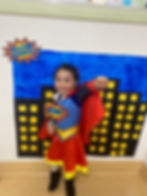 Toddler in superhero costume