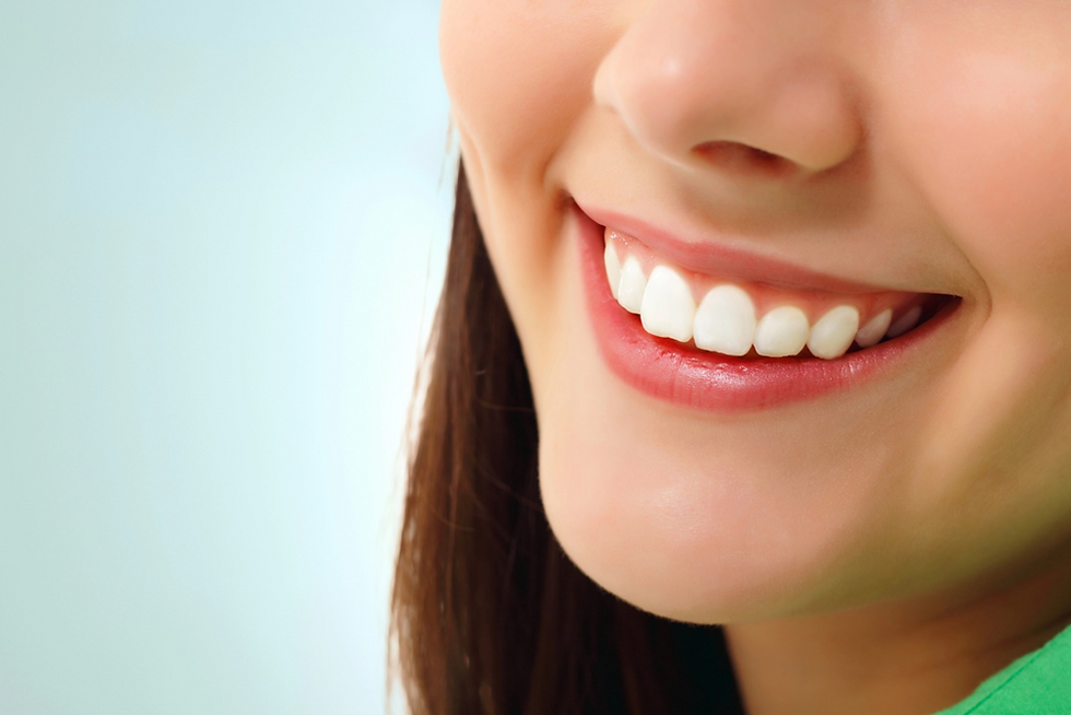 A girl smiling and showing her beautiful veneers