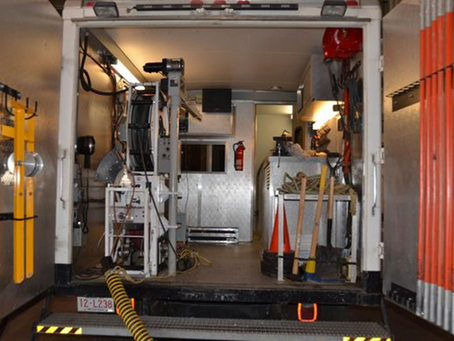 Inside commercial drain cleaning truck with hydro jetting and inspection equipment