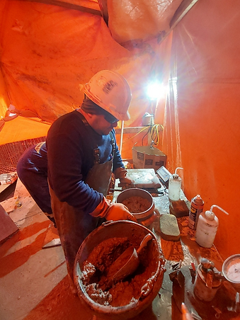 Technician performing concrete materials testing during construction quality control