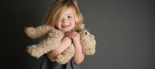 Child Hugging Teddy