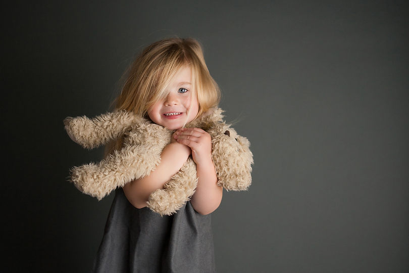 Child Hugging Teddy