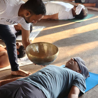 Sound healing session with singing bowls supporting stress relief, mindfulness, and nervous system relaxation.