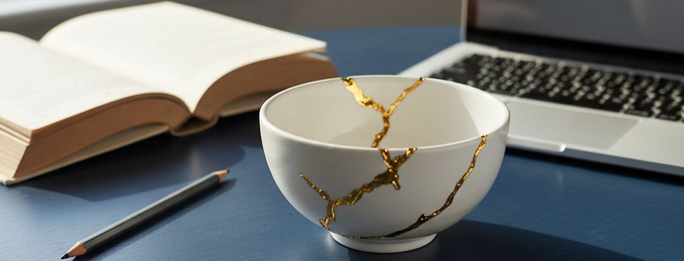 Landscape image of kintsugi on a navy blue table and bowl is white.jpg