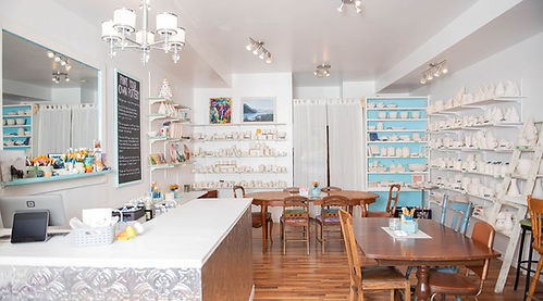 looking into Carm Haven Studios featuring all of the mugs, ceramics, art and supplies in Carm Haven Studio's creative space