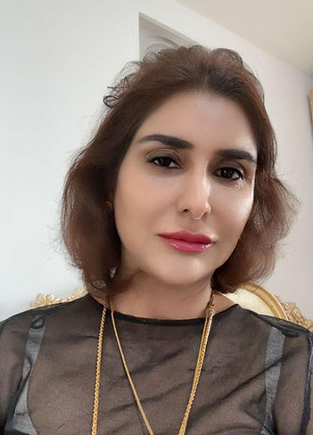 Portrait of Natasha Sadia, psychic reader and chakra healer, with biography introducing her spiritual journey