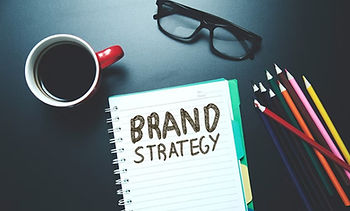 'brand strategy' written on a notebook