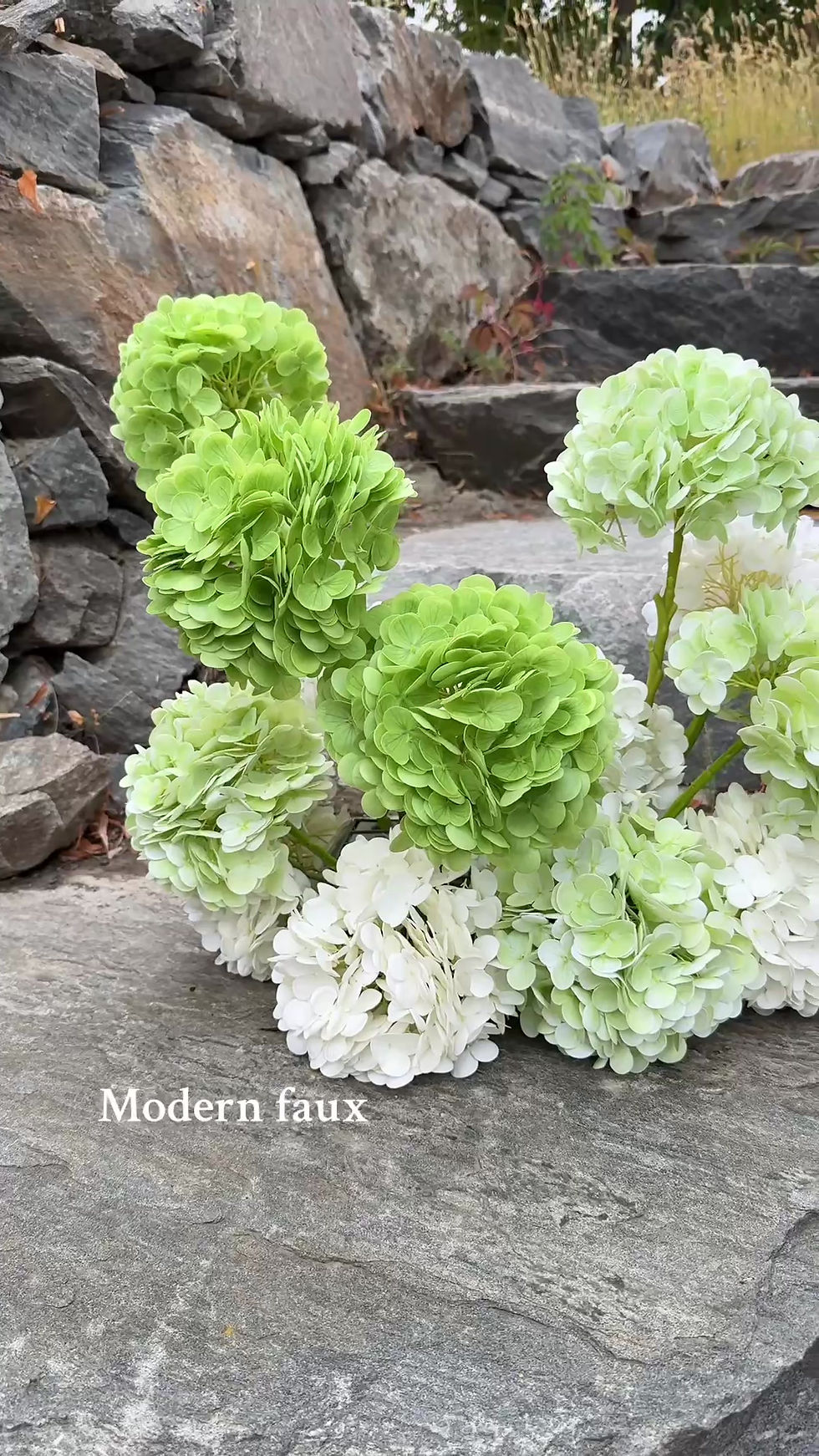 Thumbnail: Elegant artificial green monogram hydrangea floral clouds creating a lush garden aisle for Kelowna proposals and weddings