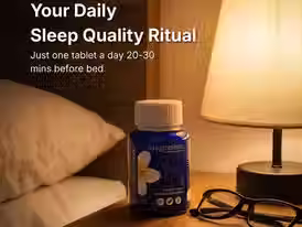 A cozy evening bedroom scene showing a blue bottle of Vitamin Green Magnesium tablets placed on a wooden nightstand beside a warm lamp, black eyeglasses, and soft white bedding. The overlay text promotes a nightly sleep ritual, suggesting one tablet 20 to 30 minutes before bed to support relaxation and restful sleep. This visual highlights a simple magnesium bedtime routine for adults looking to unwind, reduce fatigue, and enhance overall sleep wellness.