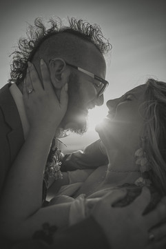 Bride and Groom holding one another, with sunset behind them, Jo-Anna Billington Wedding Photographer Yorkshire