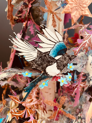 Close up of detailed magpie paper cut-out