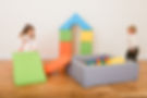 Children playing on bright soft play equipment, provided by Soft Play In A Box
