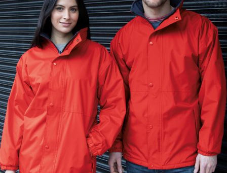 man and woman in red waterproof jackets
