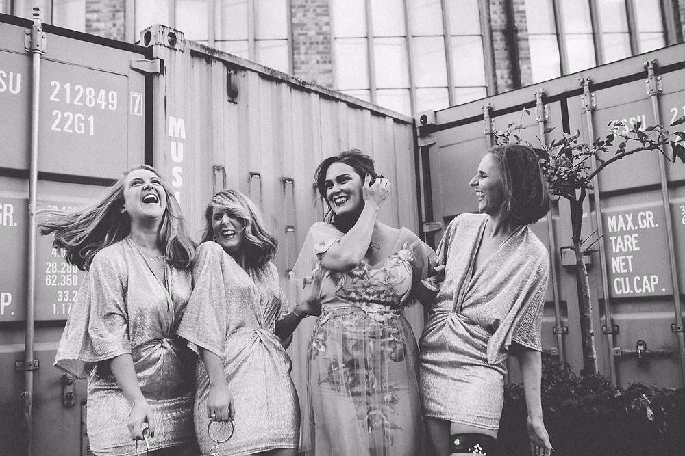 trinity buoy wharf wedding candid wedding photography bride and bridesmaids