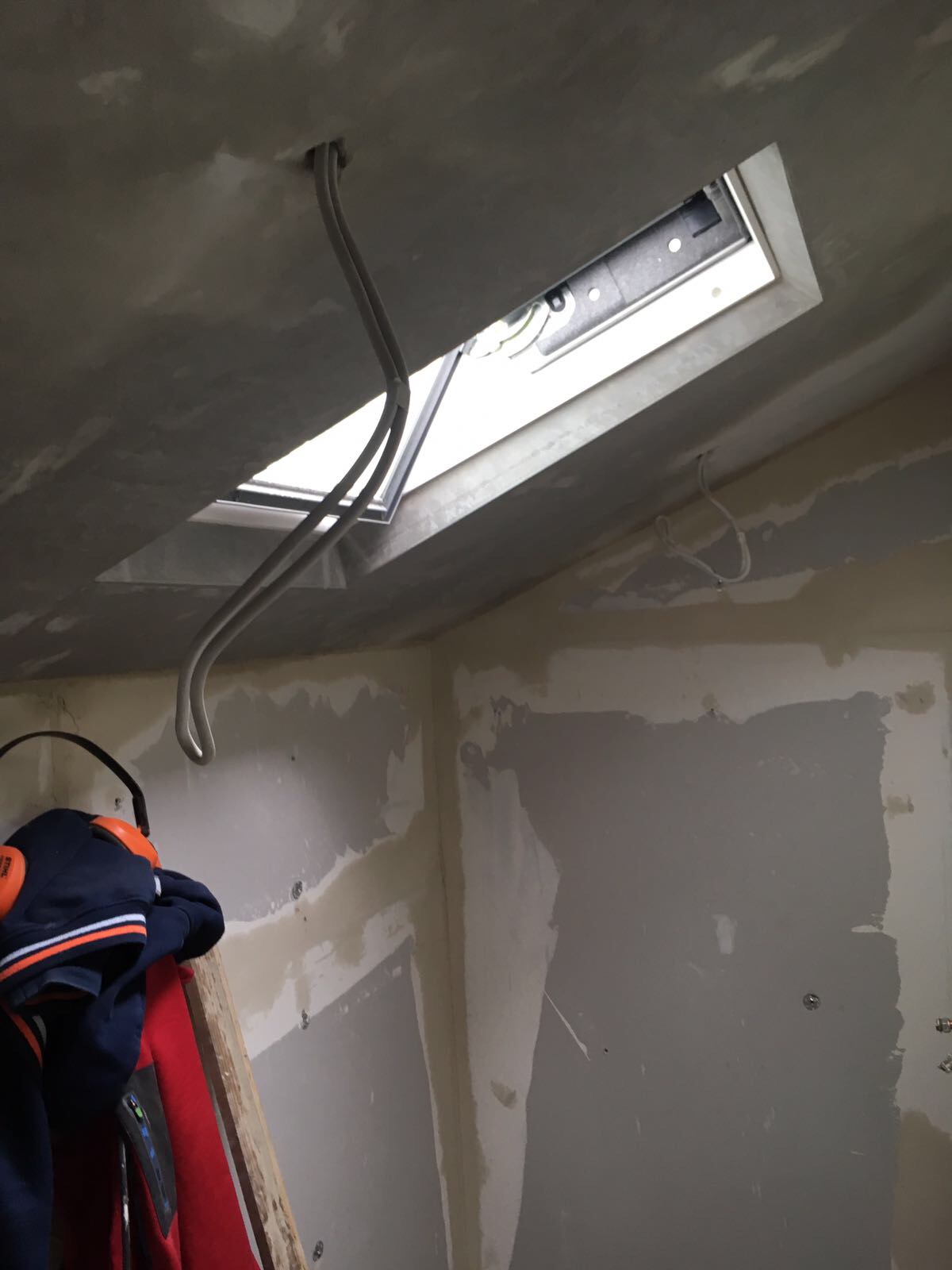 Property Repair Guys 365 Velux window roof installation to bathroom and plastering with electrical w