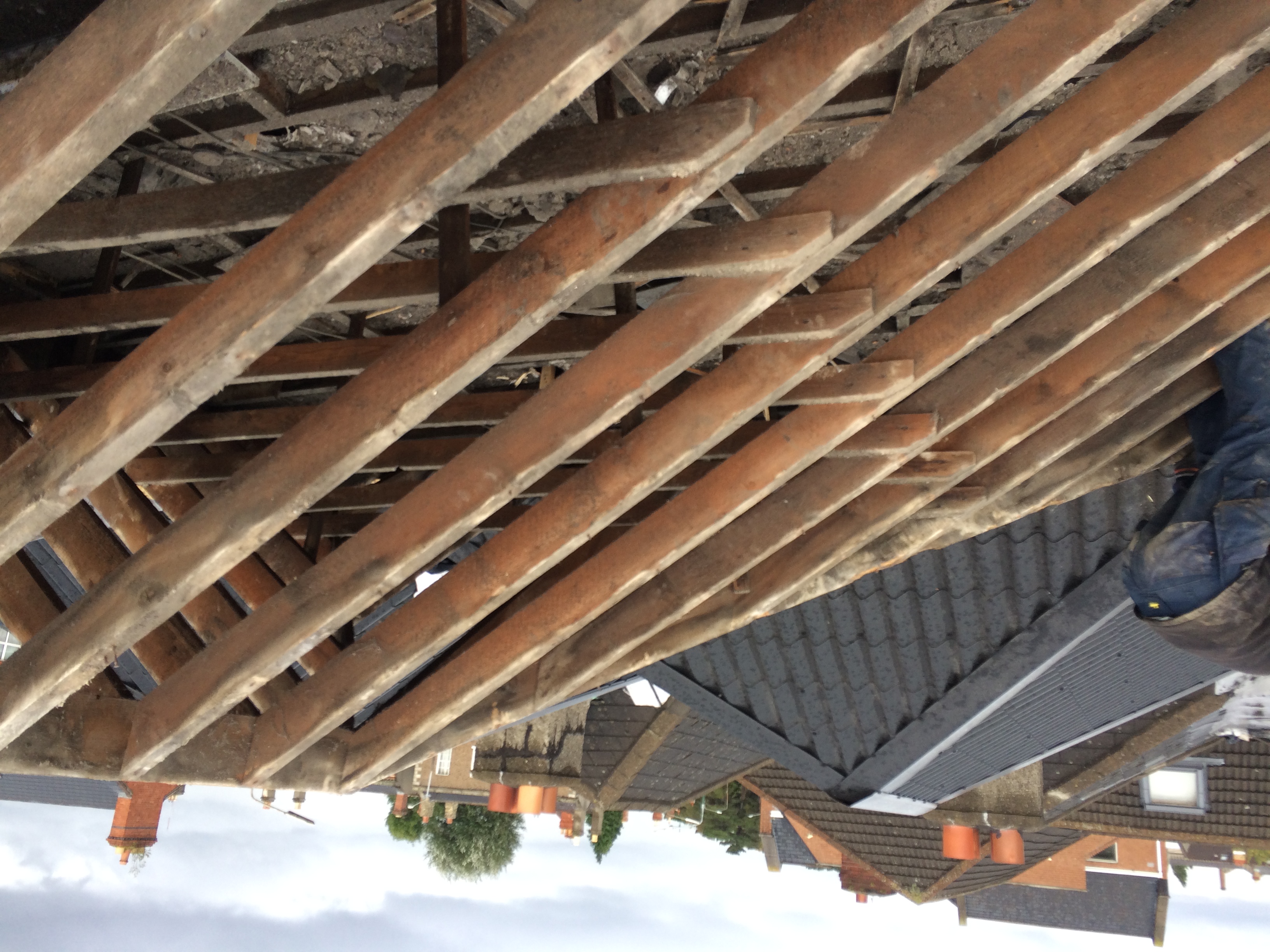 Property Repair Guys 365 Roof works to remove exisiting perished roof tiles