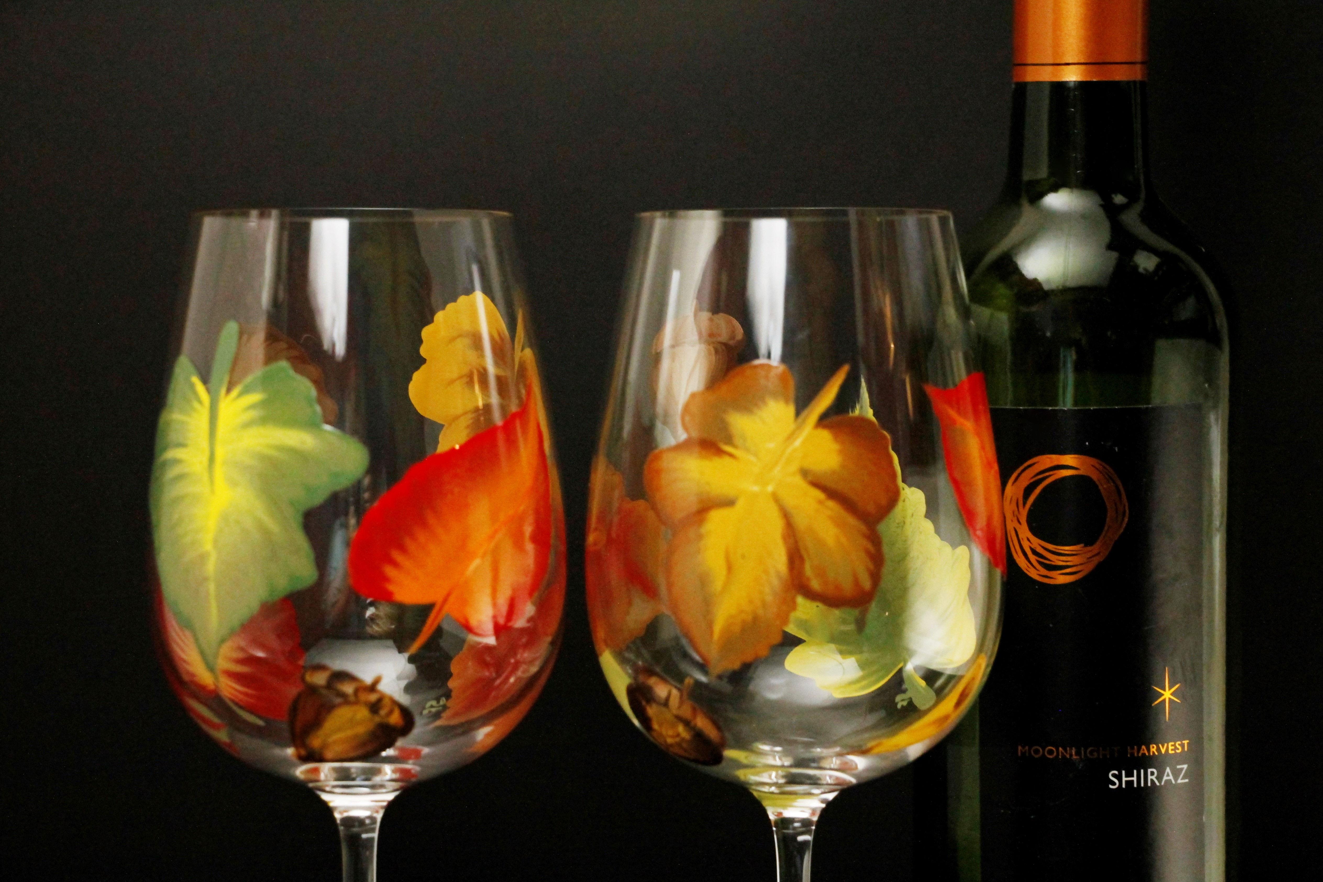 fall leaves painted onto large wine glasses