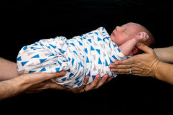 Parents holding newborn