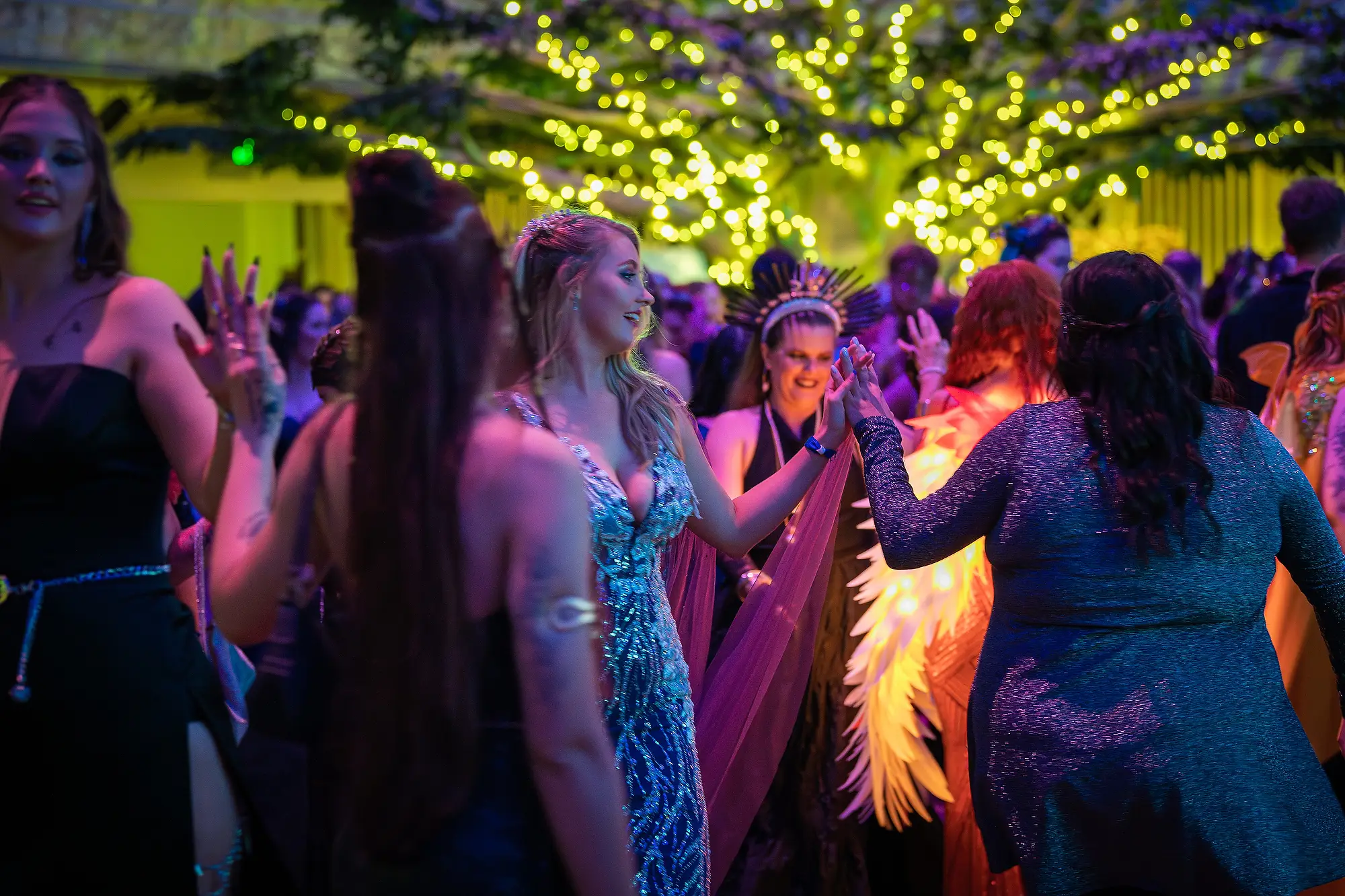 Two women dancing and laughing at Celestial Events Brisbane