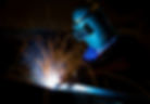 MIG welder uses torch to make sparks during manufacture of metal equipment..jpg