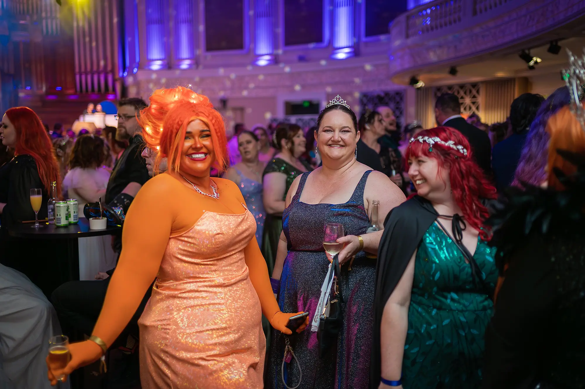 Guests in creative costumes smiling at Celestial Events Brisbane