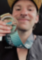 Smiling client shows off bronze medal.