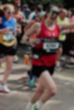 Smiling woman running a marathon