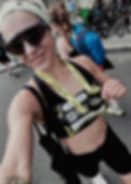 Happy woman wearing a medal, reflecting positive client feedback.