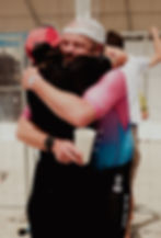 Two people hugging warmly