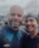 Two smiling athletes in swim gear