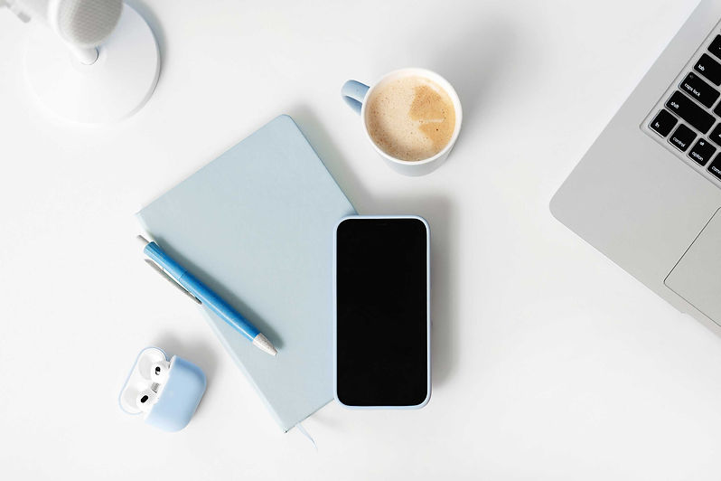 Flat lay desktop with laptop and phone