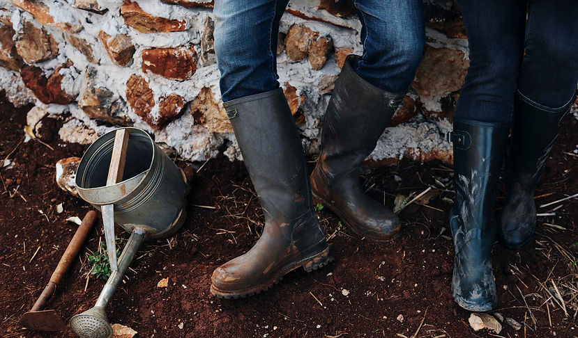 close-up-of-rubber-boots-of-farmer-and-w