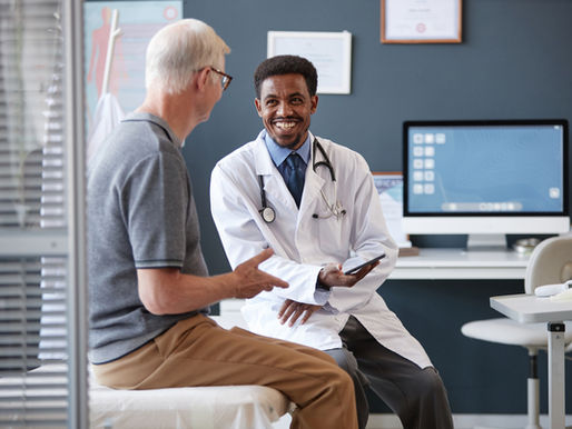 Physician talking with patient