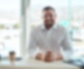 Smiling salesman at car dealership