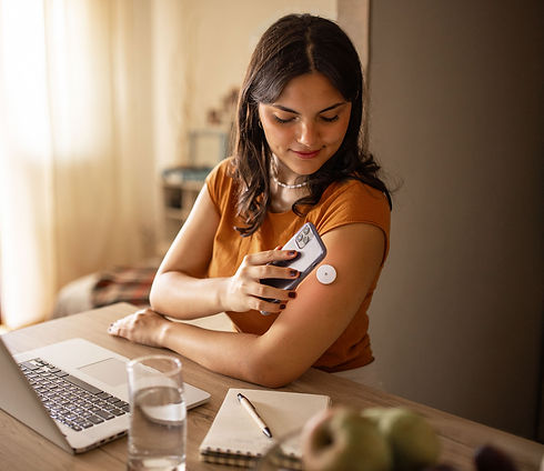 Woman checking her CGM with phone