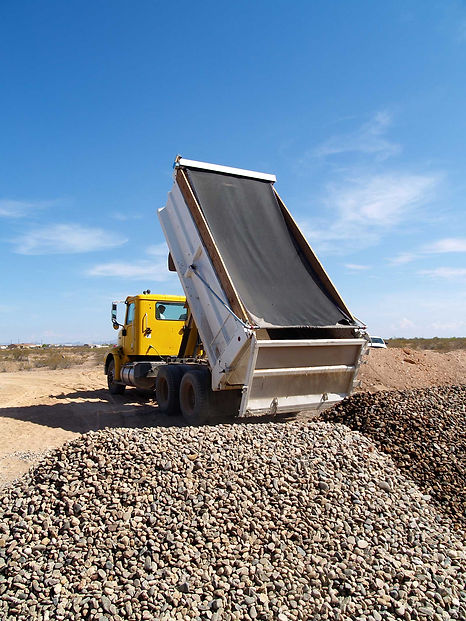 Dump truck unloading rocks