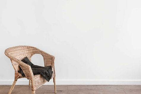 Wicker chair with throw blanket