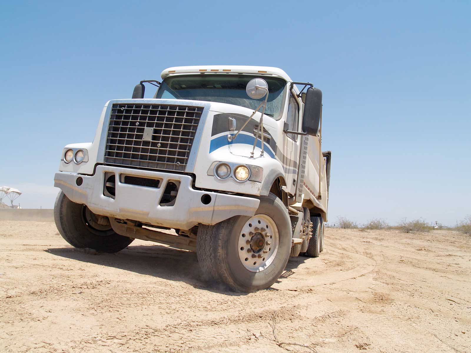 Front view of white dump truck