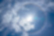 Sun flare in a cloudy sky