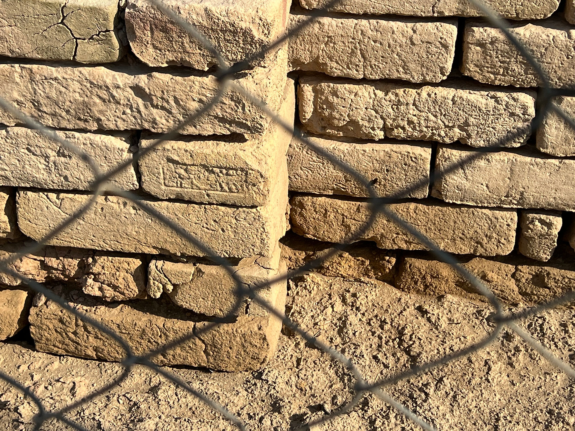 enscribed brick on palace wall