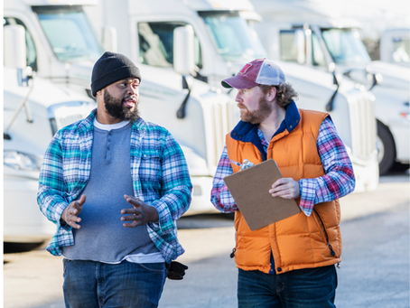Drivers at the loading dock talking about trailers.