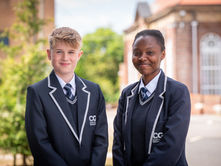 Two pupils from Chatham Grammar school in Kent looking at the camera and smiling politely