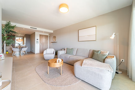Stylish living room in Casa Sunny Golf holiday apartment with comfortable seating and direct access to the terrace.
