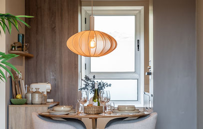 Modern spacious dining area in Casa Sunny Golf holiday apartment with comfortable chairs, overlooking living room, terrace and fully equipped kitchen.
