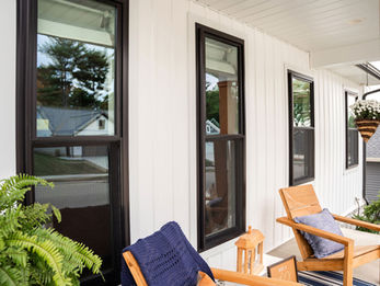 ndure™ Double Hung Windows in Textured Matte Coal Black on Front Porch