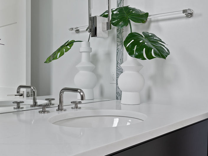 Flocked wallpaper stuns in this Zilker powder bath interior design project by Davinci Interiors.